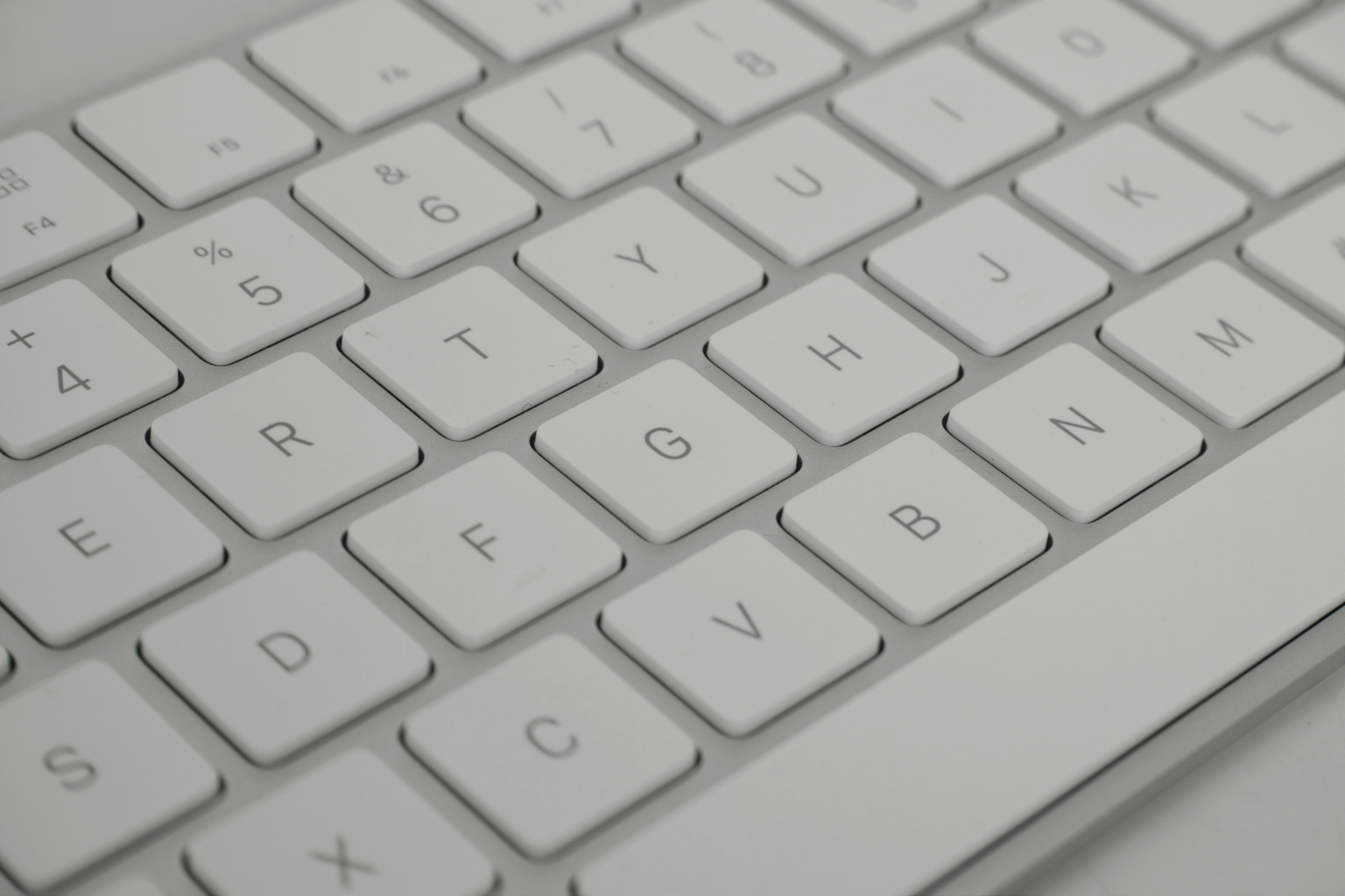 Photo of a white Apple keyboard